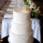 Three- tier coconut cake with white chocolate icing